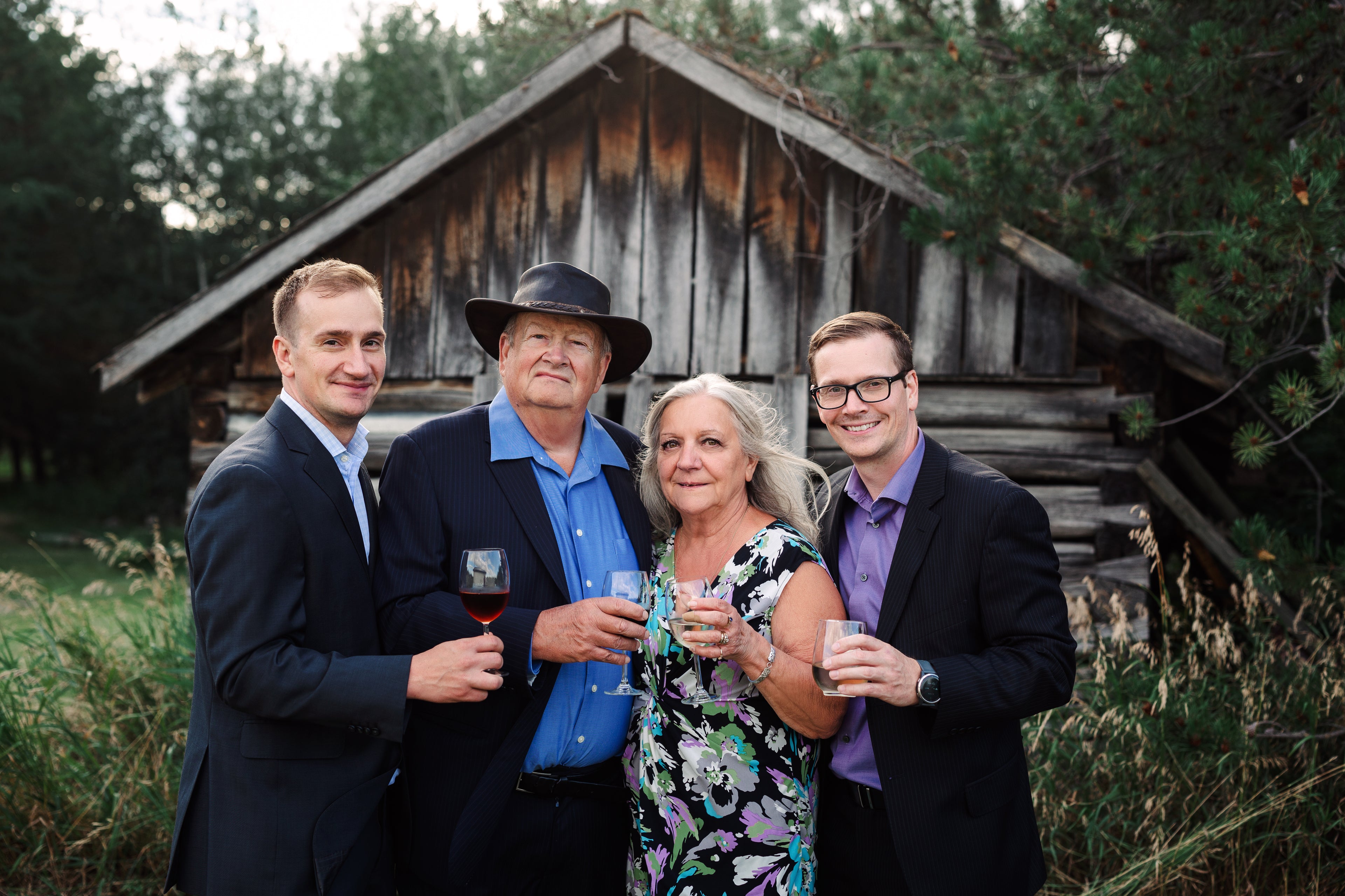 Team holding a wine