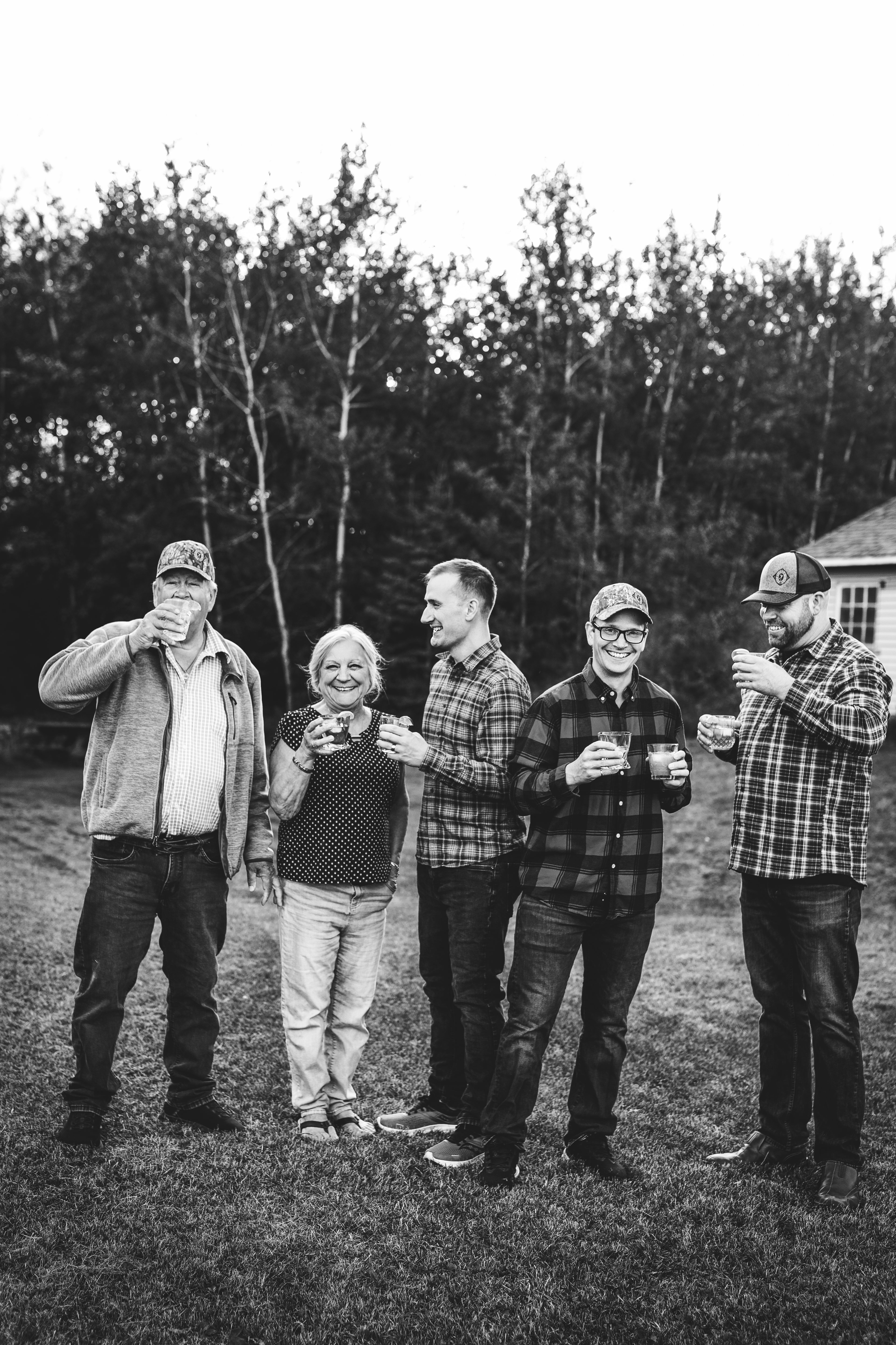 Team holding a wine BnW